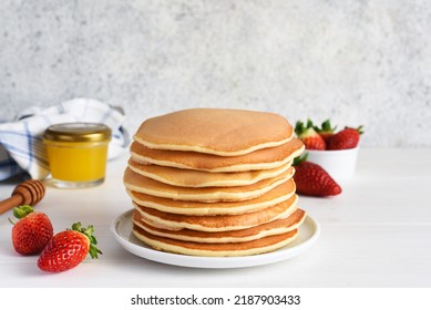 Stack of honey pancakes, homemade strawberry pancakes for breakfast - Shutterstock ID 2187903433