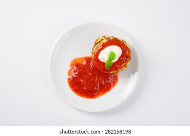 stack of hot pancakes with strawberry jam on white plate - Powered by Shutterstock