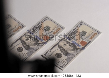 A stack of hundred-dollar bills on a white isolated background. 100 dollar bills