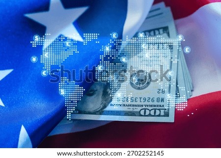 A stack of hundred-dollar bills is placed on a backdrop featuring the US flag, overlaid with a digital map of world currency symbols, reflecting global finance trends.