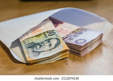 Stack of Hungarian banknotes money (forints). Europe Hungary - Shutterstock ID 2112074150