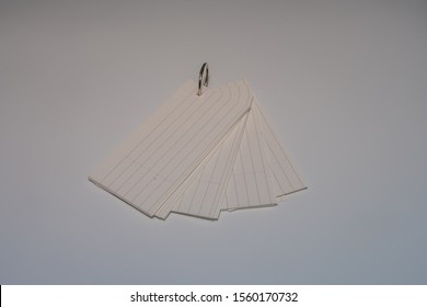 Stack Of Index Cards Held Together With Metal Ring Isolated On White Background.