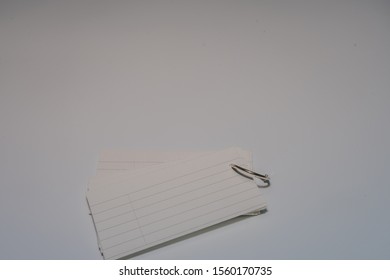 Stack Of Index Cards Held Together With Metal Ring Isolated On White Background.