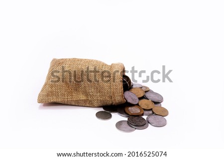 Stack of Indian coin to fall on isolated white background.