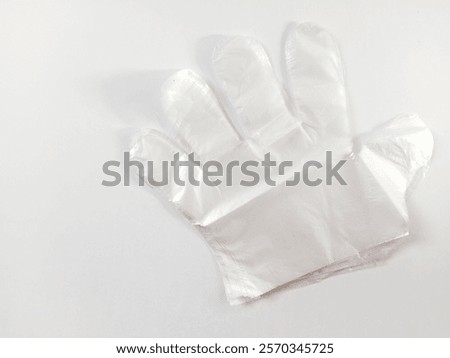 Stack of isolated transparent plastic gloves