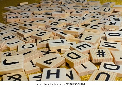 A stack of letters. loosely scattered on a table.