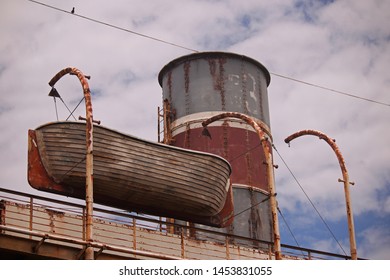 STACK AND LIFEBOAT ON DECK OF STAGED SHIPWRECK