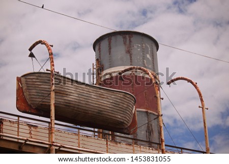 STACK AND LIFEBOAT ON DECK OF STAGED SHIPWRECK