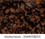  Stack of logs arranged in a coudy day close shot eye level