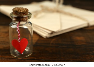 Stack Of Love Letters With Little Bottle On Rustic Wooden Table Background