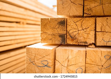 Stack of lumber wooden beams prepared to build a house