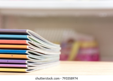 Stack magazines on wood  desk.  School education concept.
(selective focus ) - Shutterstock ID 793358974