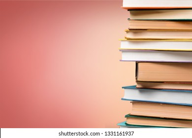 Stack of many old books on shelf in book store or library room with white wall background. Knowledge learning, education, bachelor degree in university or back to school concept.
    
    - Image - Shutterstock ID 1331161937