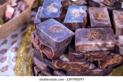 A Stack Of Maple Scented, Home Made, Lye Soap On Display At A Craft Fair