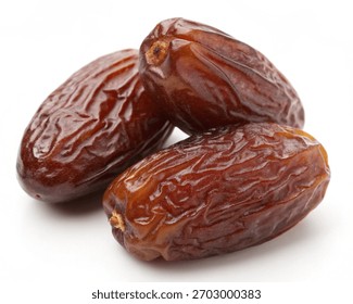 Stack of Medjool Dates behind on white background