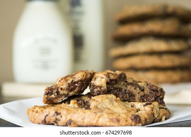 Stack Of Melted Gooey Chocolate Chip Cookies For Dessert With Milk