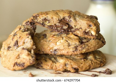 Stack Of Melted Gooey Chocolate Chip Cookies For Dessert With Milk