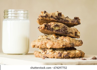 Stack Of Melted Gooey Chocolate Chip Cookies For Dessert With Milk