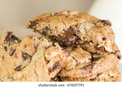 Stack Of Melted Gooey Chocolate Chip Cookies For Dessert With Milk