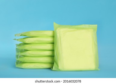 Stack Of Menstrual Pads On Light Blue Background