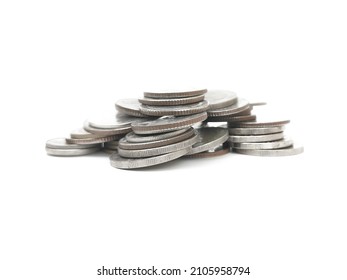 Stack of metal coins of various sizes.  Old coins stacked on white background.