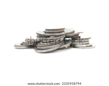 Stack of metal coins of various sizes.  Old coins stacked on white background.
