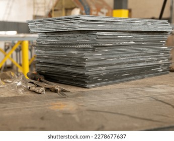 Stack of metal sheets in packs at warehouse of products