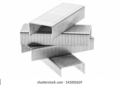 Stack of metal staples. Isolated on a white background.