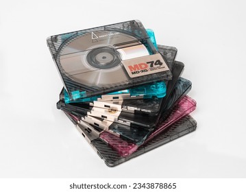 A stack of mini discs stacked in steps on a white background with reflection