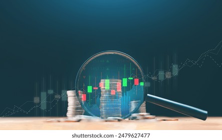 Stack of money coin and magnifying glass with graph and candle stick chart. Business and financial concept. Stock market analyzing, stock information search. - Powered by Shutterstock