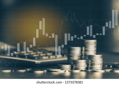 Stack of money coin with trading graph, financial investment concept use for background