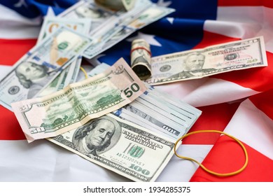 Stack Of Money On American Flag. Dollars