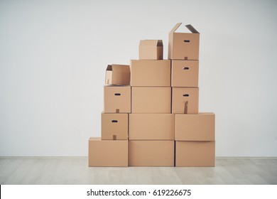 Stack Of Moving Boxes In New House