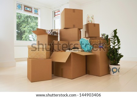 Stack of moving boxes in new house
