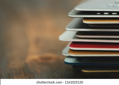 Stack of multicolored credit cards close-up 