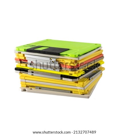 stack of multi-colored diskettes on white background. Colored floppy disks. copy space.