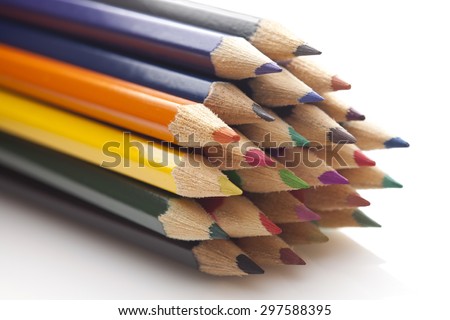 Stack of multicolored pencils close up isolated on white background