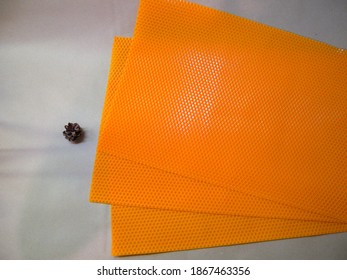 Stack of natural bee wax sheets. Natural candles, fragrant with honey, will be made from these sheets.