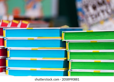 Stack of new books on the table. Books on the forum of manufacturers of printed products.