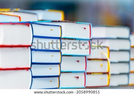 Stack of new books on the table. Books on the forum of manufacturers of printed products.