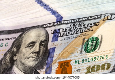 Stack Of New Design Of US Currency One Hundred Dollar Bills With Focus On Ben Franklin Portrait