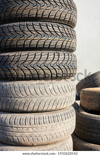 Stack\
of new and used car tires during wheel\
replacement