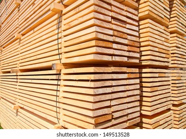 Stack Of New Wooden Studs At The Lumber Yard