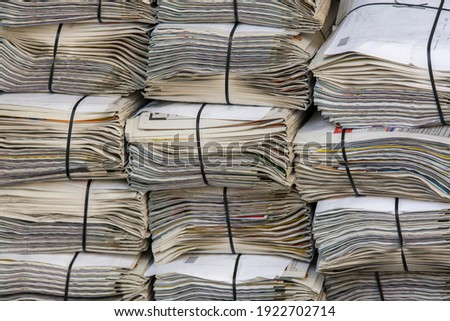 a stack of newspapers in closeup