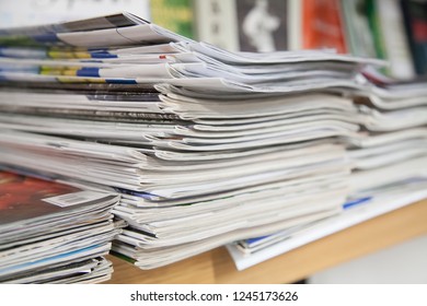 a stack of newspapers library