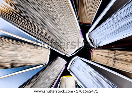 Stack of old book education concept background, many books piles with copy space for text, Book tops, Old and used hardcover books, top view. Educational concept. Close up