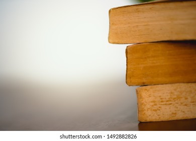 Stack of old books on the table.