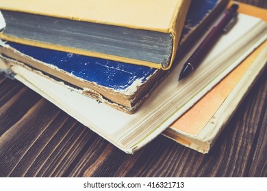 Stack of old books on a table\ vintage style \ education concept