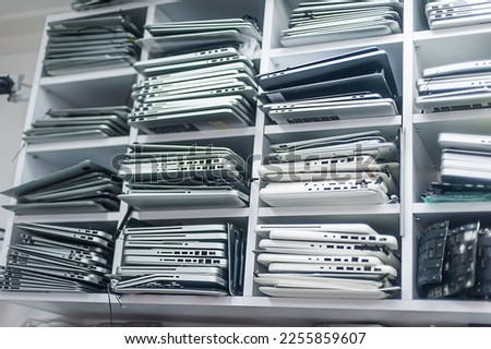 Stack of old, broken and obsolete laptop computer for repair and recycle