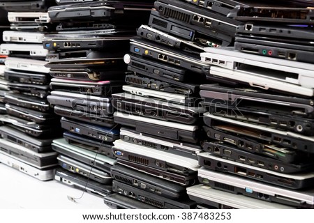 Stack of old, broken and obsolete laptop computer for repair and recycle
